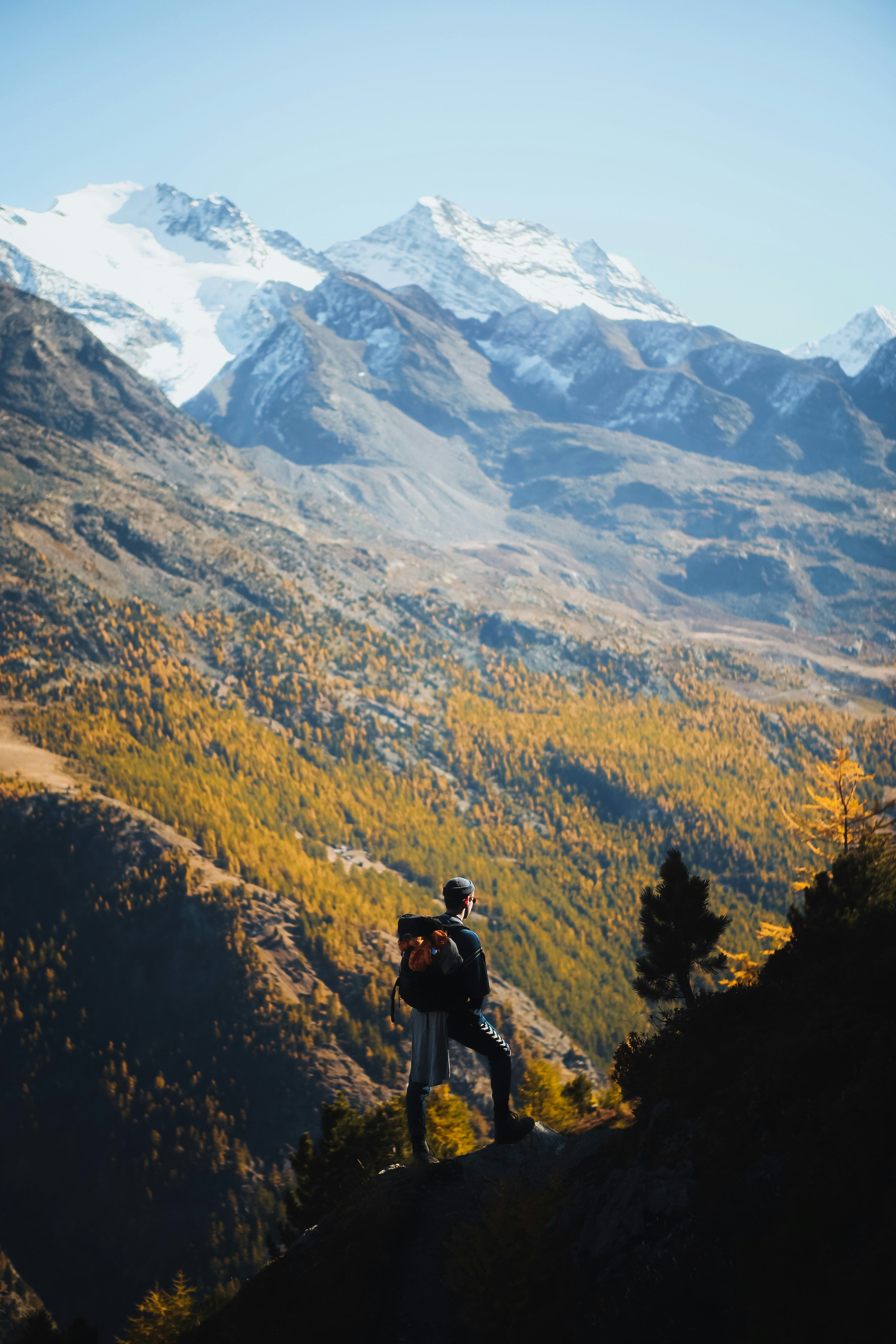 Hiker overlooking mountain vista symbolizing the journey to financial success